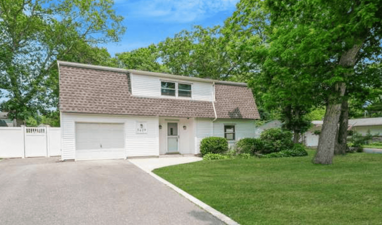 Front exterior of home after improvements in Holtsville, New York