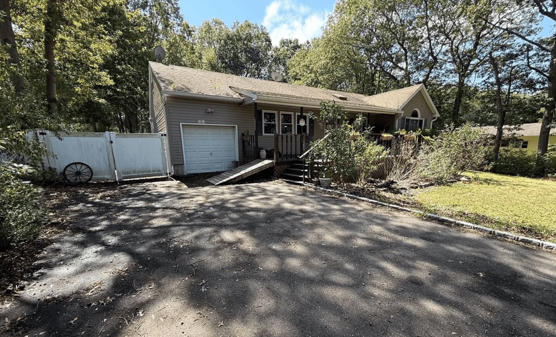 Front exterior before renovation at 14 Clearview, Selden, NY
